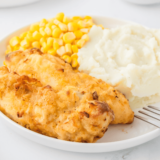 Golden, crispy Cracker Barrel-style fried chicken tenders served on a plate, hot and ready to enjoy.