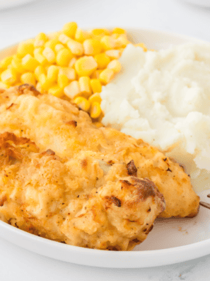 Golden, crispy Cracker Barrel-style fried chicken tenders served on a plate, hot and ready to enjoy.