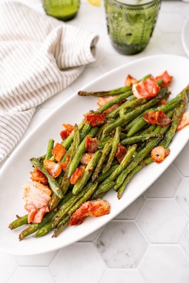 Southern-style Cracker Barrel green beans with bacon and onions in a rustic serving bowl