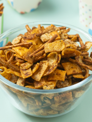 Close-up of homemade Frito Snack Mix with pretzels, nuts, and seasoned corn chips