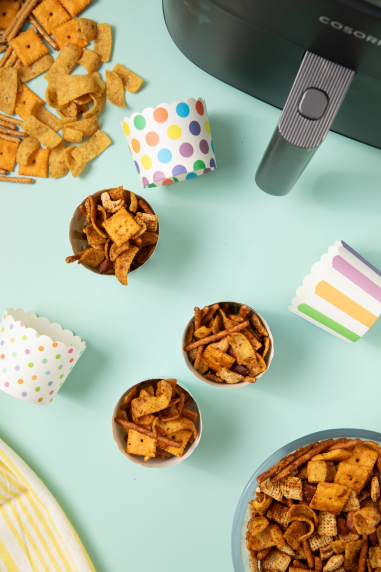 Bowl of Frito Snack Mix with crunchy Fritos, pretzels, nuts, and flavorful seasoning