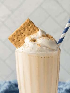 Thick and creamy Ninja Creami copycat Sonic Cheesecake Milkshake topped with whipped cream and a cherry.