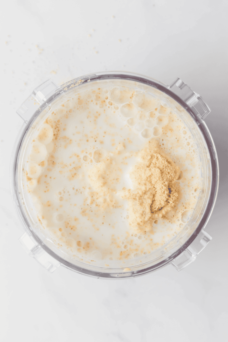 Adding crushed graham crackers to the milkshake mixture in a Ninja Creami for a cheesecake-style texture and flavor.

