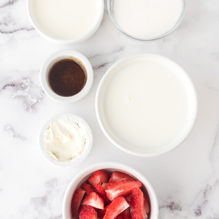 Ingredients needed for Ninja Creami Dairy Free Strawberry Ice Cream on kitchen table.