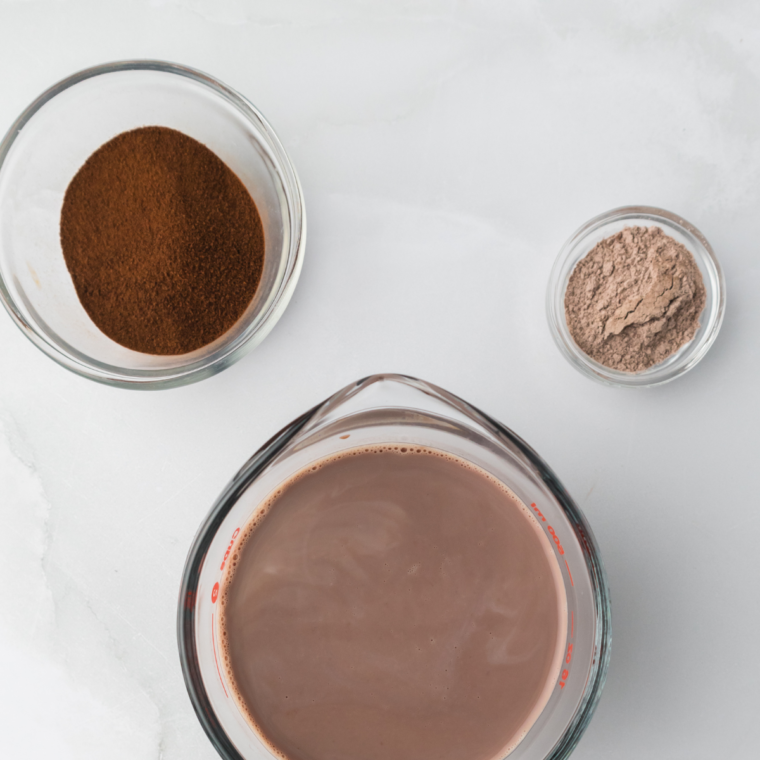Ingredients needed for Ninja Creami Frozen Hot Chocolate on kitchen table.