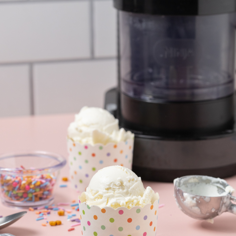 Smooth and creamy frozen yogurt made in a Ninja Creami, served in a bowl and topped with fresh fruit.