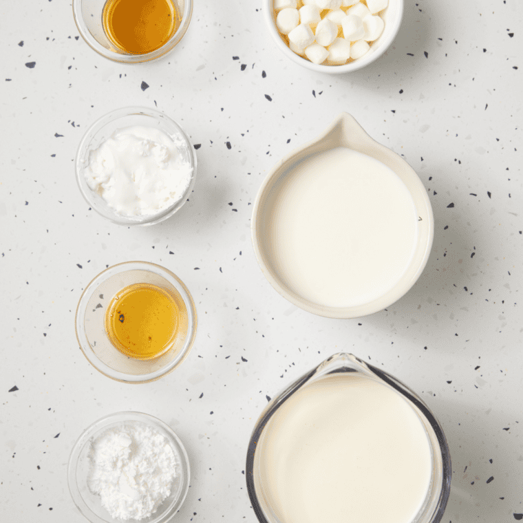 Ingredients needed for Ninja Creami Marshmallow Sky Ice Cream on kitchen table.