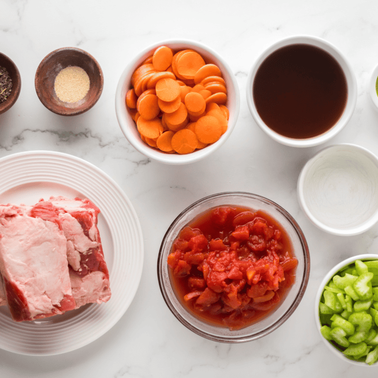 Ingredients needed for Ninja Foodi Beef Osso Buco on kitchen table.