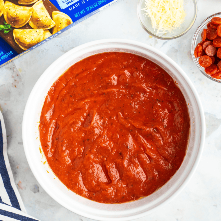 Layer of pizza sauce on the bottom of the casserole dish.