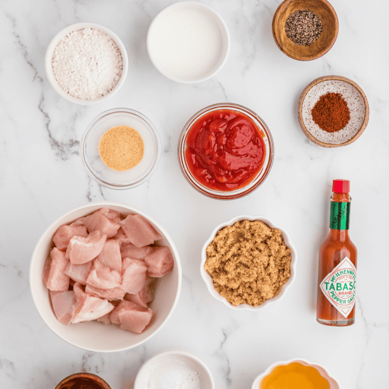 Ingredients needed for Sweet Honey Bourbon BBQ Sauce on kitchen table.