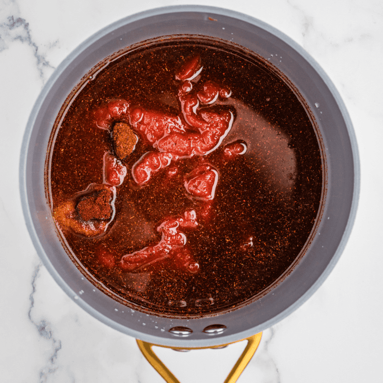 All ingredients for honey bourbon BBQ sauce added to a saucepan, ready to be stirred and simmered.