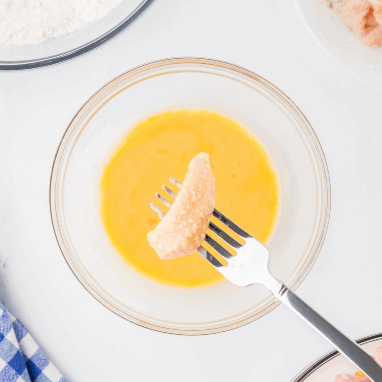 Three shallow dishes of seasoned flour, beaten egg, and crushed Cheetos