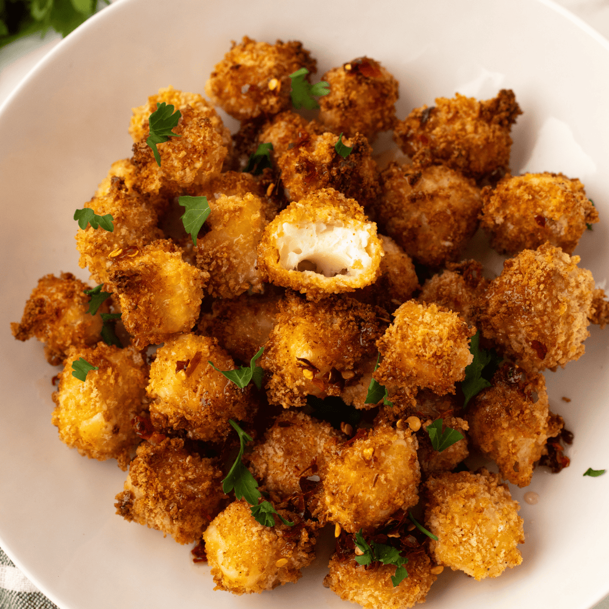 Air Fryer Crispy Halloumi Bites with a golden, crispy exterior and soft interior.