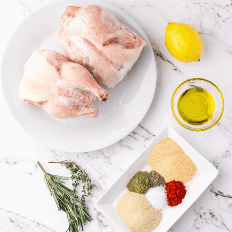 Ingredients needed for Air Fryer Frozen Cornish Hen on kitchen table.
