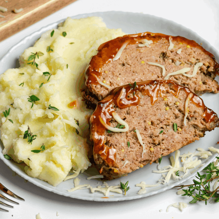 Air Fryer Guinness Cheddar Meatloaf with melted cheese and Guinness-infused flavor.