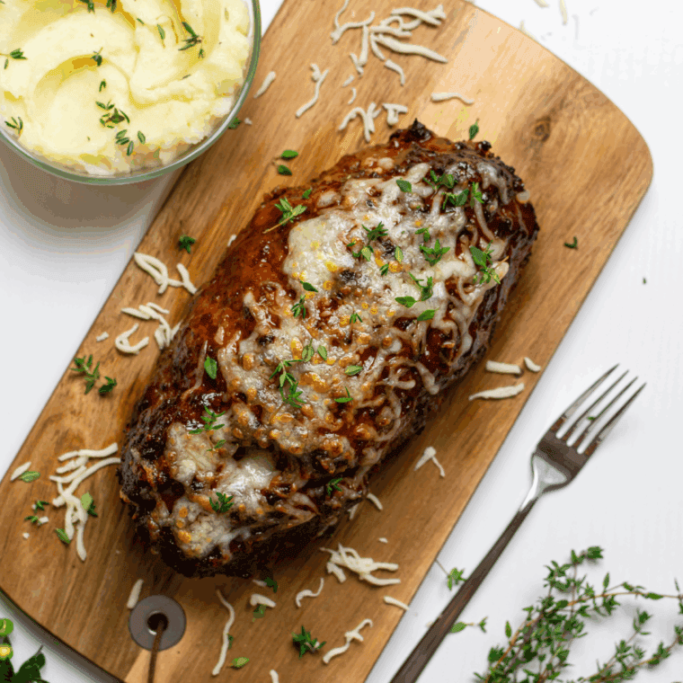 Air Fryer Guinness Cheddar Meatloaf with melted cheddar cheese and rich Guinness flavor.
