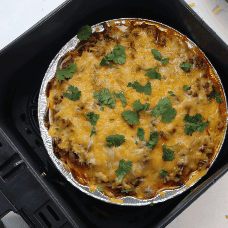 Air Fryer Mexican Lasagna with beef, tortillas, cheese, and Mexican spices.