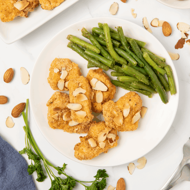 Crispy almond-coated chicken pieces cooked in the air fryer, drizzled with a savory sauce for a healthier homemade version of Panda Express Almond Chicken.