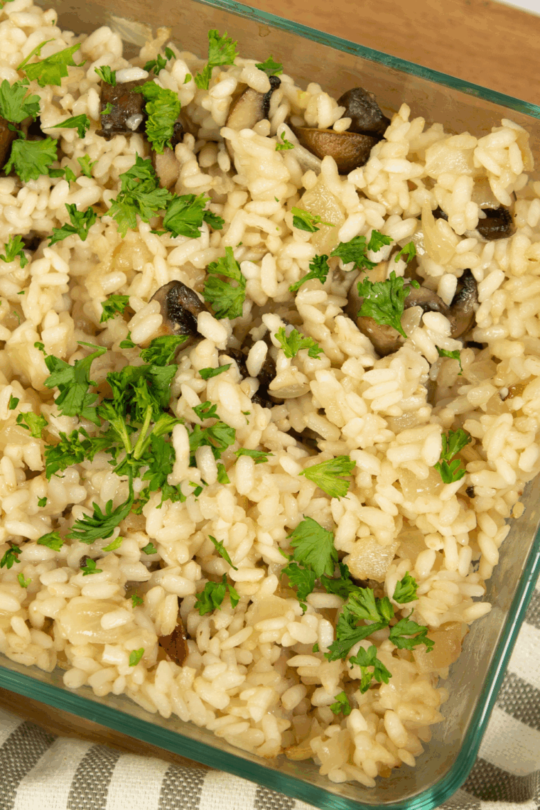 Tall pin image of creamy air fryer risotto topped with parsley and Parmesan