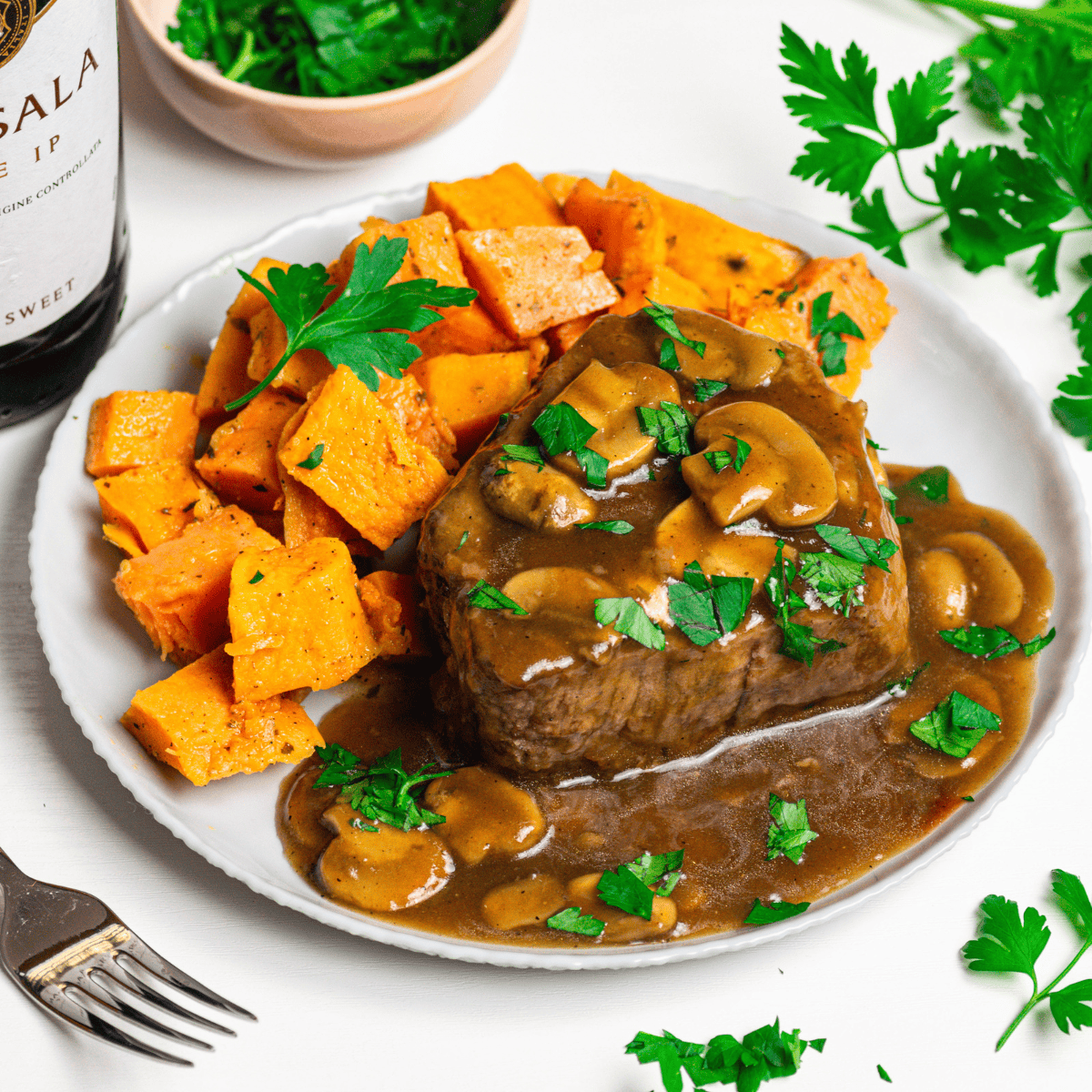 Make a savory Air Fryer Steak Marsala in no time! Tender steak cooked in a rich Marsala wine sauce with mushrooms, all made quickly in your air fryer for a delicious dinner.
