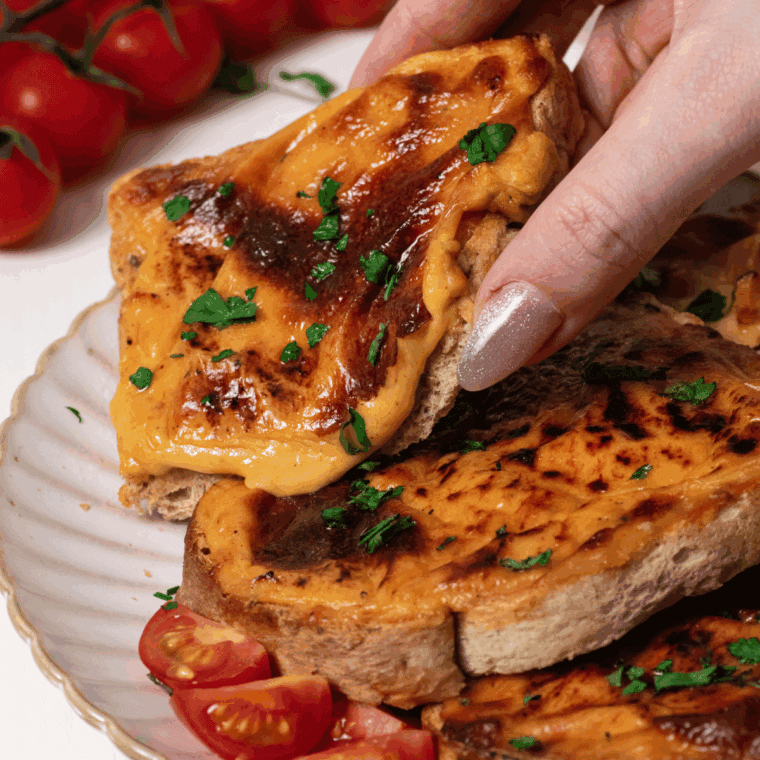 Delicious Air Fryer Welsh Rarebit with melted cheese sauce on toasted bread.