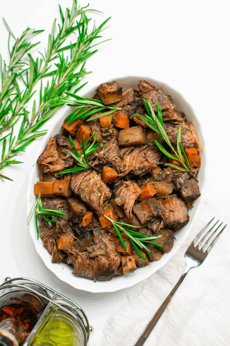 Air Fryer Yankee Pot Roast with tender meat, carrots, potatoes, and savory seasoning.
