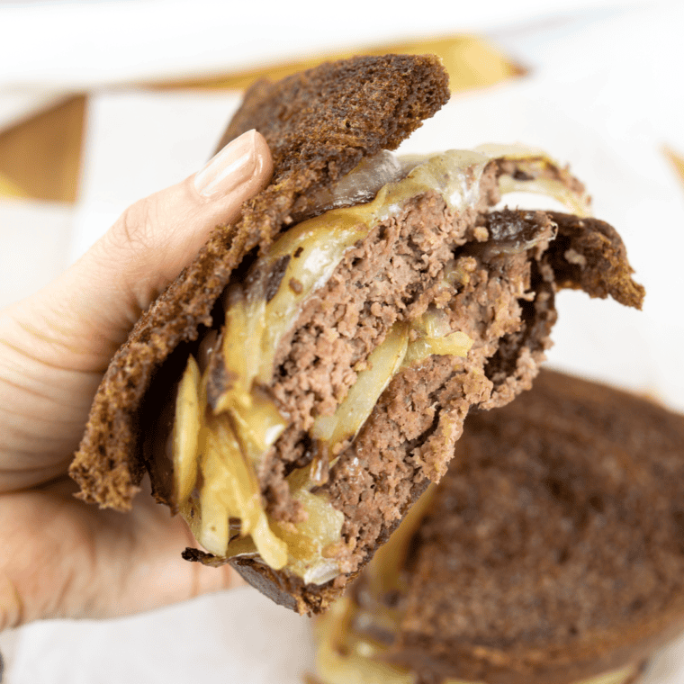 Close up view of Blackstone Patty Melt holding the sandwich.