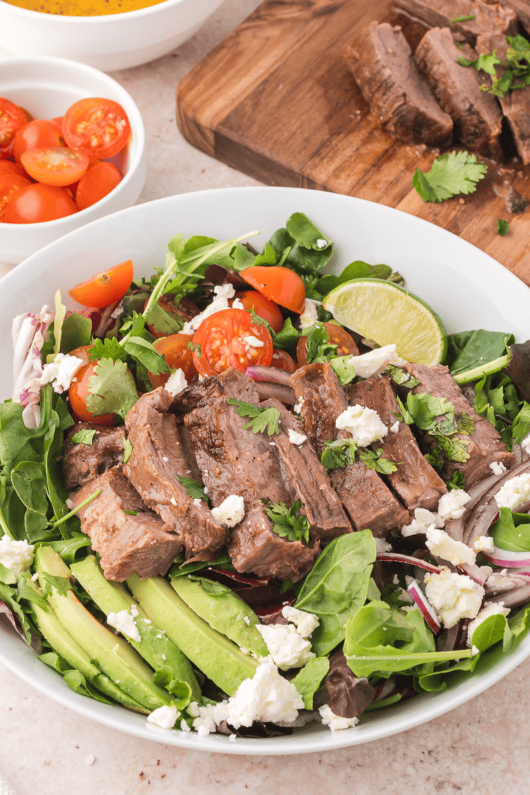 Easy Trader Joe’s Carne Asada Salad with marinated carne asada, fresh vegetables, and a zesty dressing.