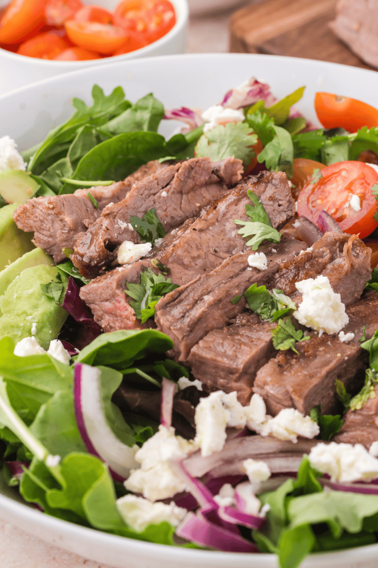 Easy Trader Joe’s Carne Asada Salad with grilled carne asada, fresh vegetables, and a savory dressing.