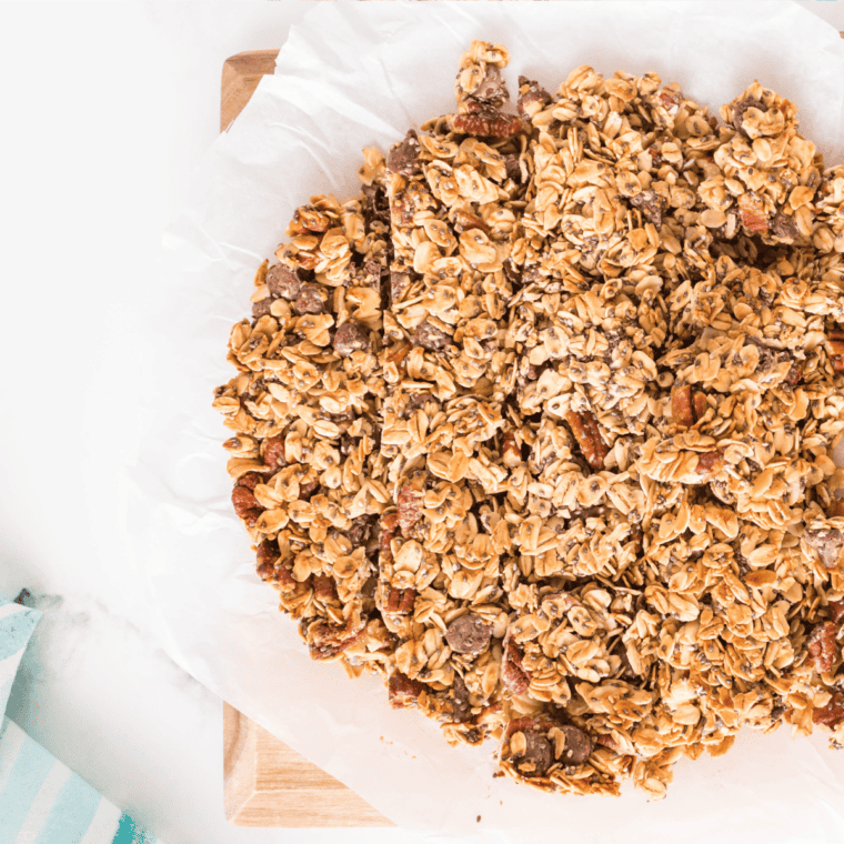 Baking the granola in the oven, stirring halfway through to ensure even crisping, then cooling before storing.
