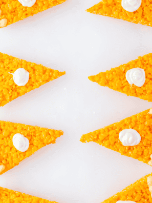 Rice Krispie Treats made with marshmallow fluff, golden and gooey.