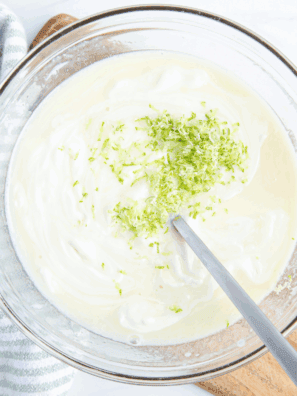 Homemade Key Lime Curd with fresh key limes, creamy texture, and tangy flavor.
