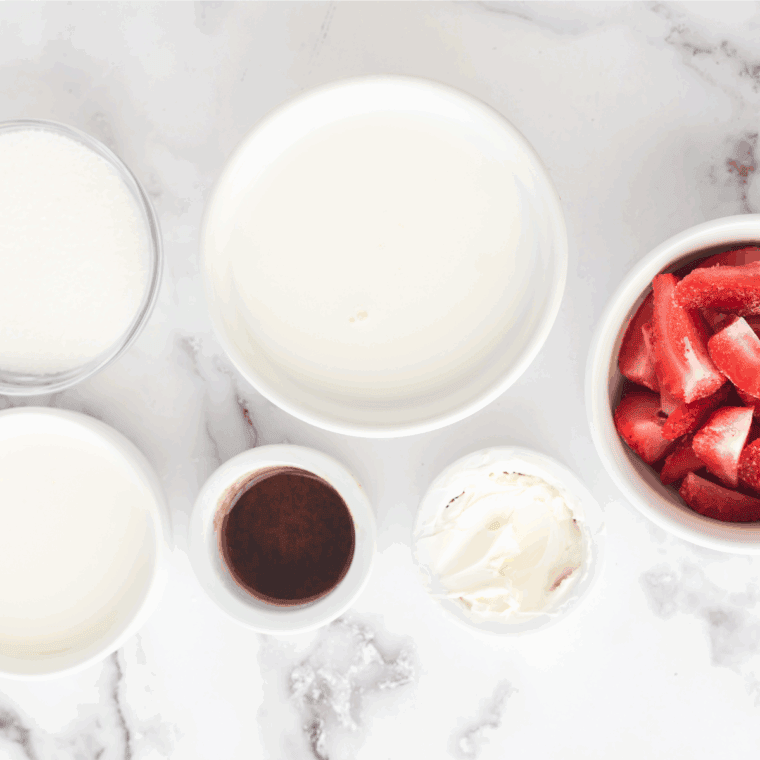 Ingredients needed for Ninja Creami Starbucks Strawberry Cheesecake Frappuccino on kitchen table.