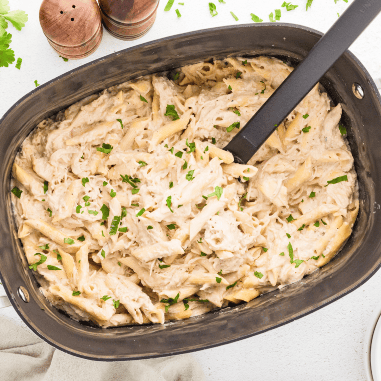 Slow Cooker Olive Garden Chicken Pasta with creamy Alfredo sauce and tender chicken.

