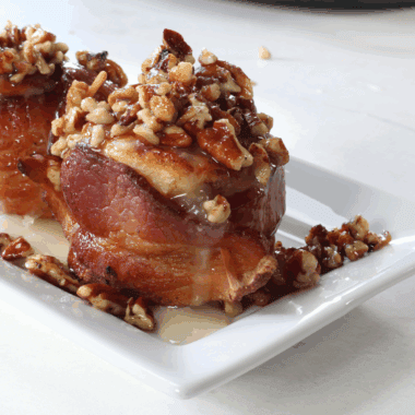 Air Fryer Bourbon Bacon Cinnamon Rolls with a crispy exterior, gooey cinnamon filling, and topped with crispy bacon and a hint of bourbon.