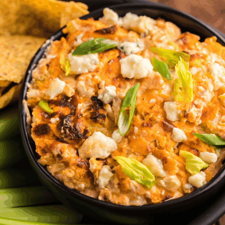 Air Fryer Buffalo Cauliflower Dip with creamy cheese, spicy buffalo sauce, and crispy cauliflower, served as a tasty, healthy appetizer.