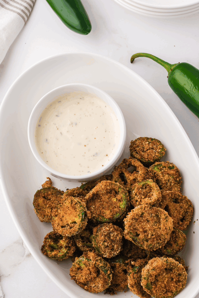 Golden, crispy Air Fryer Jalapeno Coins coated in Parmesan breadcrumbs, offering a spicy and crunchy snack inspired by Red Robin’s famous appetizer.