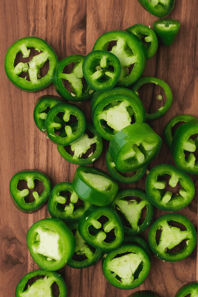 Slice the Jalapenos: Slice fresh jalapenos into ¼-inch thick rounds, removing seeds for a milder heat.
