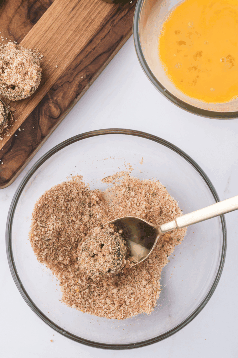 Prepare the Coating: Set up a breading station with flour, garlic powder, salt, pepper, egg wash, and panko breadcrumbs mixed with Parmesan cheese.