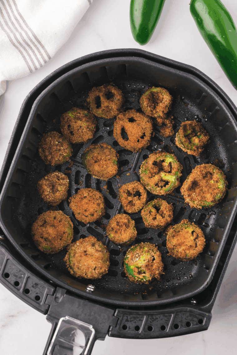 Crispy Air Fryer Jalapeno Coins coated in breadcrumbs and Parmesan cheese, offering a spicy kick and golden texture, inspired by Red Robin's popular appetizer.
