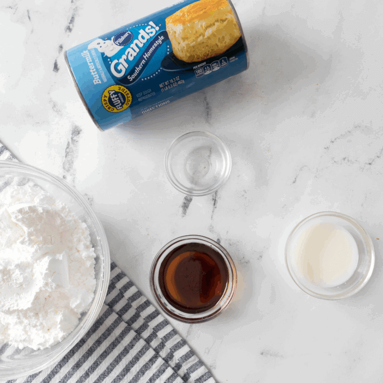 Ingredients for air fryer maple bars: canned biscuits, powdered sugar, maple syrup, maple extract, milk and salt
