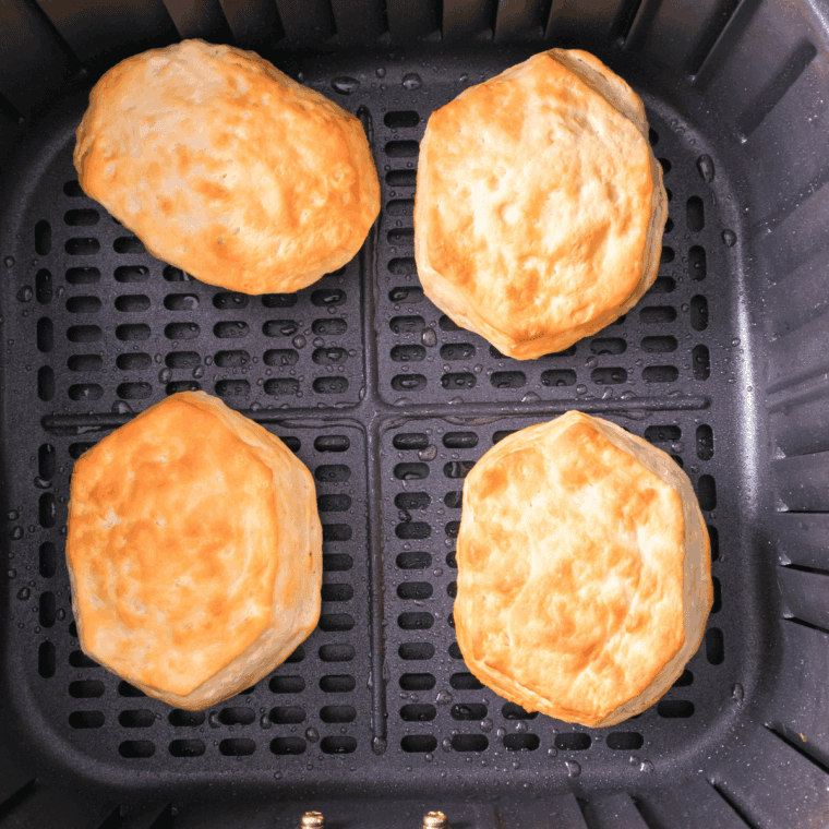 Biscuit maple bars arranged in a single layer in the air fryer basket before cooking