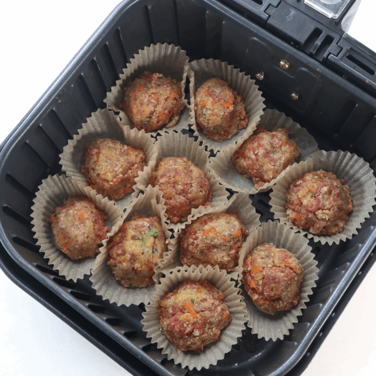 Place meatloaf cupcakes (raw) into the air fryer basket in a single layer.