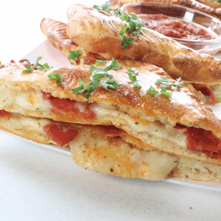 Air Fryer Pizza Turnovers with gooey cheese and savory pizza fillings, perfectly golden and crispy.