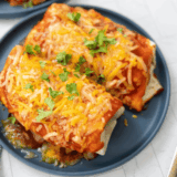 Blackstone Wet Burrito with seasoned beef, beans, cheese, and enchilada sauce, cooked to crispy perfection on the Blackstone griddle.