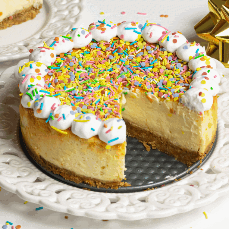 Cheesecake Factory Copycat Celebration Cheesecake, featuring a rich, creamy filling, graham cracker crust, and colorful fruit topping, perfect for any festive occasion.