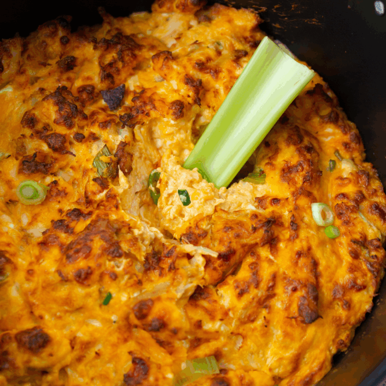 Hot and creamy Hooters-style buffalo chicken dip served with tortilla chips and celery sticks for dipping