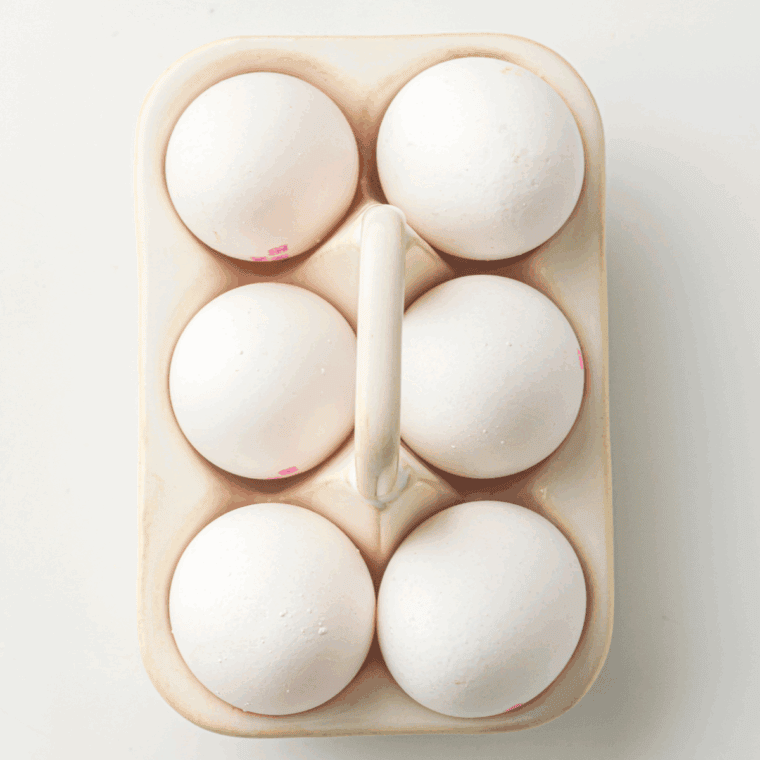 Ingredients needed for Instant Pot No Peel Hard Boiled Eggs on kitchen table.