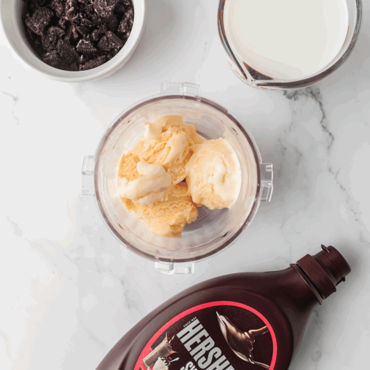 Ingredients needed for Ninja Creami Jack In The Box Oreo Shake Recipe on kitchen table.