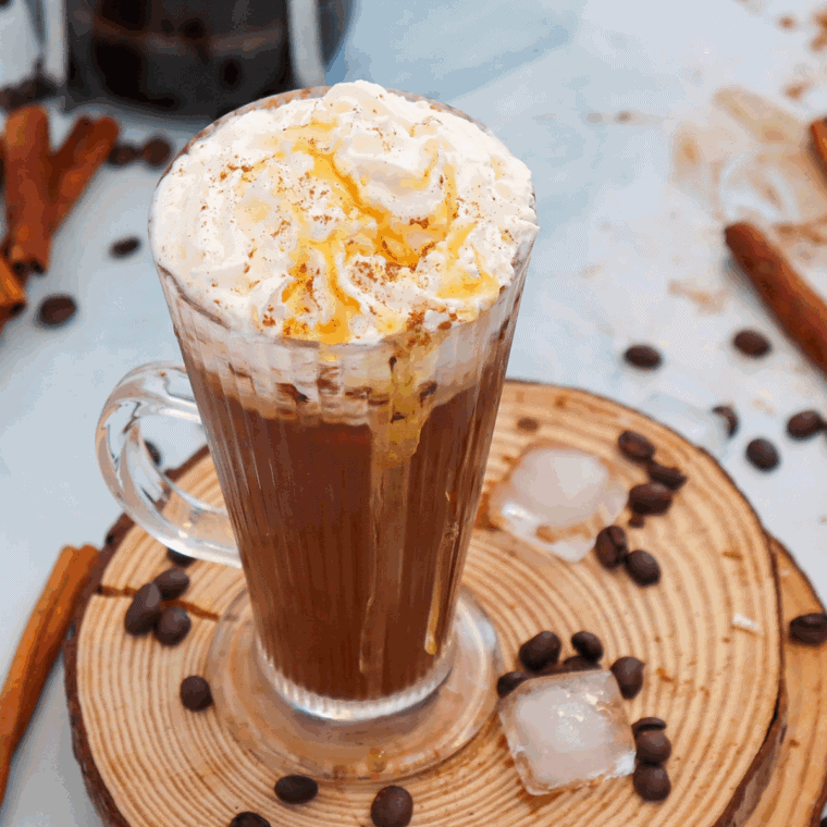 Homemade Starbucks Cinnamon Dolce Latte with espresso, cinnamon syrup, steamed milk, and whipped cream, topped with a sprinkle of cinnamon.
